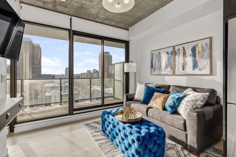 Bright living room with large view of the city.