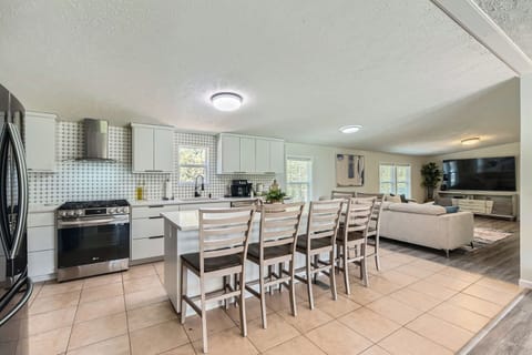 Beautiful and spacious kitchen with island seating as well. 