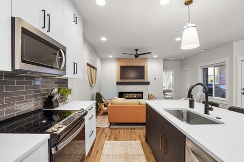 Modern kitchen and living space with sleek finishes.