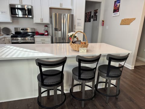 A lovely welcome basket & card await you, with cozy swivel barstool chairs.