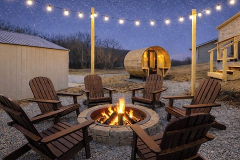 Enjoy the fire pit area under warm string lights