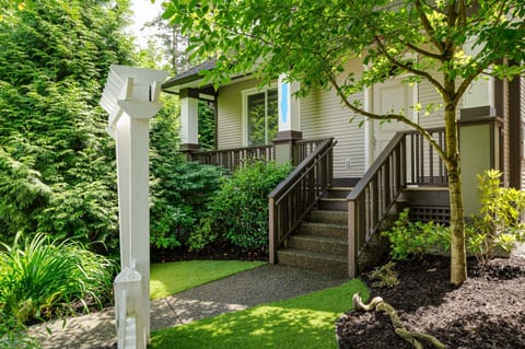 Front of house with trees and privacy.