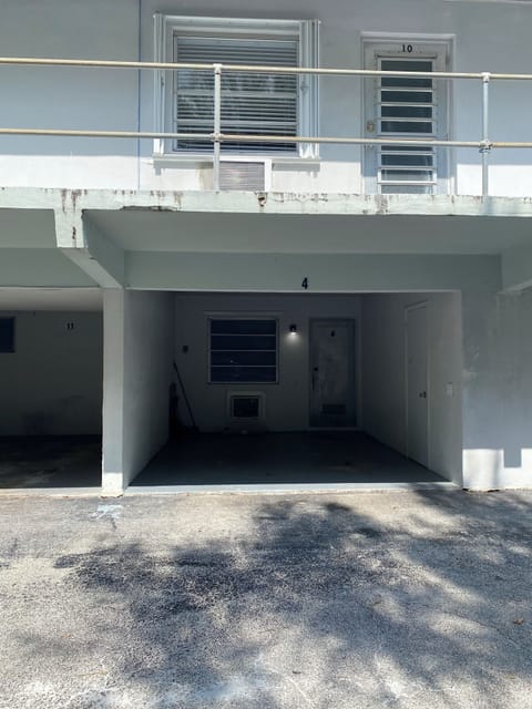 Back entrance main door with carport