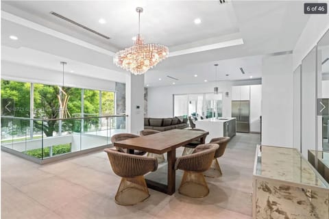 Open dining and living space filled with natural light