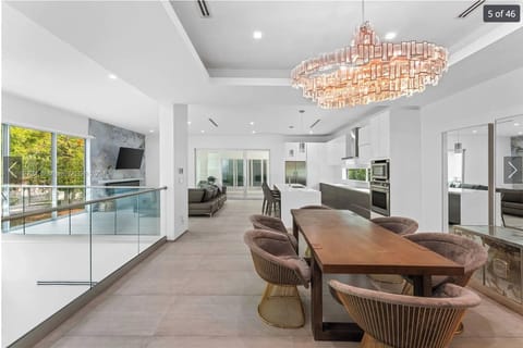Spacious formal dining area with designer lighting