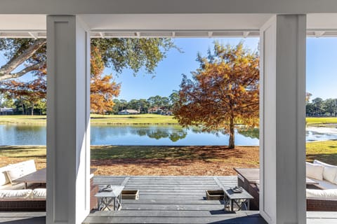Step onto your private covered patio and soak in breathtaking lake views framed by golden autumn trees.