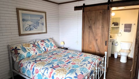 #105 is a studio with a full bath, a queen bed, and a futon for the kids.