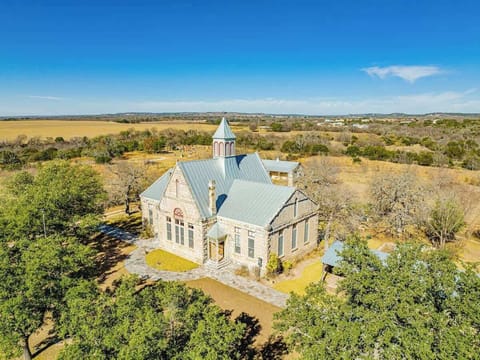 An entire compound, the Schoolhouse featured here lies in the heart of the 10-acre property. Used for it's dining room, living room, and bar, the Schoolhouse is a perfect place for your guests to gather. Note that this building doesn't have bedrooms.