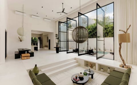 Sunken living room with soaring ceilings and statement accents.