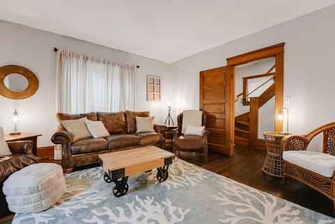 Inviting living space featuring warm wood details and comfortable seating—ideal for gathering with family and friends.
