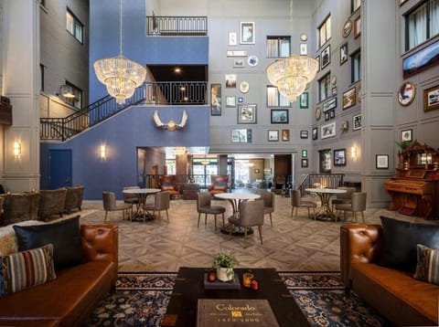 Gather with friends in a soaring lobby filled with art.