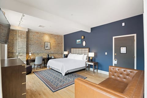 Stretch out in a stylish room with exposed-brick charm.