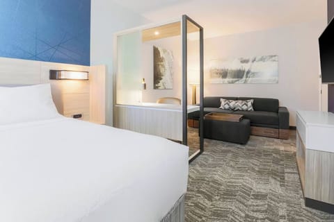 Unwind on the sofa after sinking into crisp bedding.