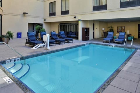 Dive into a refreshing swim in this serene courtyard pool.