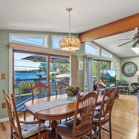 Sun drenched dining/living room with gorgeous unobstructed lake view.