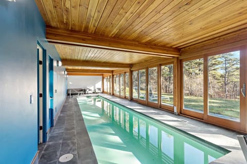 Welcome to Griffins Island Hideaway, an amazing mid-century rental hidden away in beautiful Wellfleet, MA. Enjoy the private indoor lap pool with wall of glass overlooking the backyard,