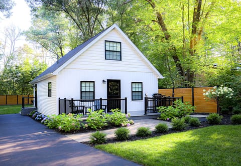 Modern chalet in wooded neighborhood, canopied by mature oaks & beautiful pines.