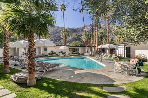 All rooms open onto the central pool courtyard.