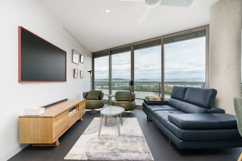 Stream the latest releases from the comfort of your light-filled lounge, designed for those who appreciate both style and substance.