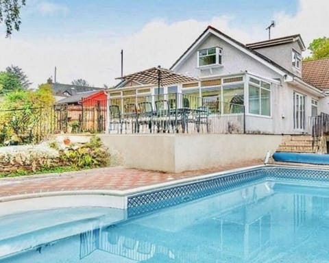 The Plymouth Pool House — ideal for family breaks, group celebrations, and team stays, with a private heated pool, games space, and room for up to 14 guests.