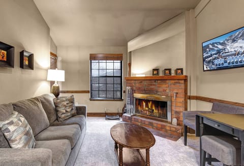 Cozy up in your inviting living room with a crackling brick fireplace and plush sectional sofa.