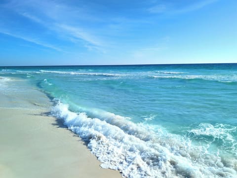 White sand beach emerald waters, just steps away