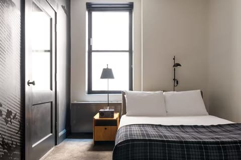 Wake up refreshed beside bright windows and crisp linens.
