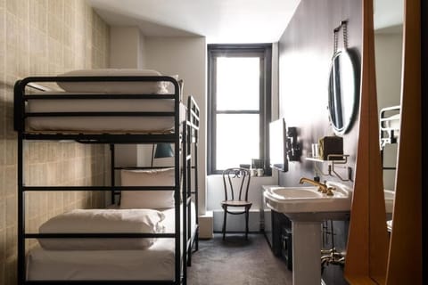 Settle into crisp bunks in a bright, cozy room.