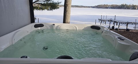 Relax in our 7 person hot tub on the deck