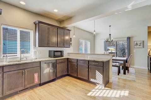 Our fully stocked kitchen offers ample cabinet space and sleek granite surfaces to handle meal prep with ease. It features professional-grade appliances and an intentional layout that flows into the main dining area.
