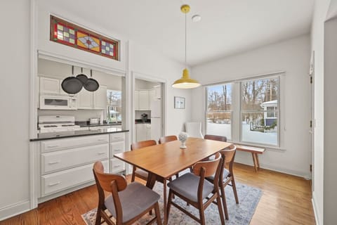 Comfortable dining setup that connects seamlessly to the kitchen and living room for easy entertaining.