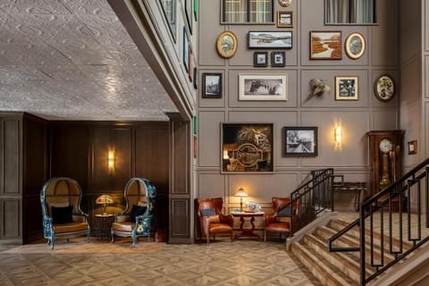 Enjoy live-music vibes beside the polished piano and art wall.