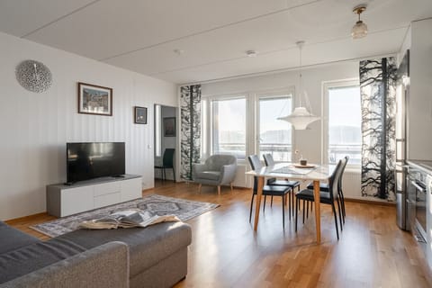 From the living room, you can step out onto your private, glassed-in balcony and enjoy stunning lake views.