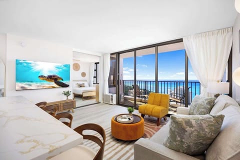Experience the ultimate Hawaiian getaway in this light-filled, newly renovated condo where panoramic ocean views meet chic, tropical design.