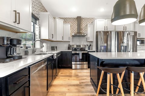 Fully stocked kitchen with 2 dishwashers and 2 fridges