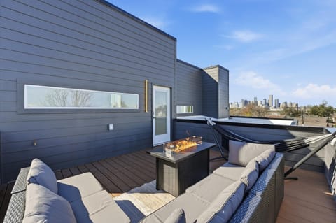 Private rooftop terrace with AMAZING skyline views, firepit and cozy lounge area
