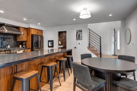 Your modern kitchen flows into a welcoming dining space, perfect for morning coffee or evening meals together.