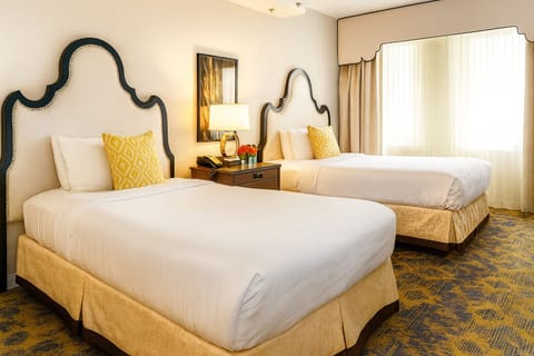 Unwind in crisp linens with two plush queen beds.