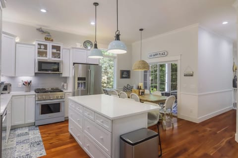 Professionally-designed and stocked with KitchenAid stainless steel appliances.