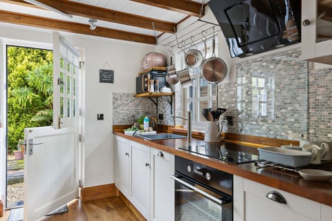 Kitchen with kettle, toaster and stable to door to patio - Beryas Cottage