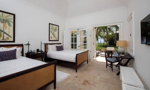 Settle into crisp twin beds with garden-to-ocean scenery