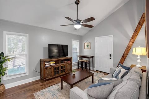 Living room with queen size sleeper sofa, TV with Netflix, small table for eating/computer work

(Notice the ladder to get up to the queen bedroom loft area)