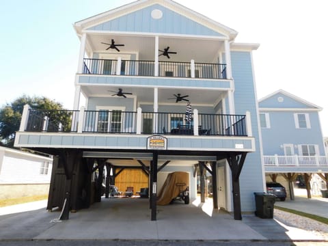 Spacious elevated home with dual balconies and covered parking