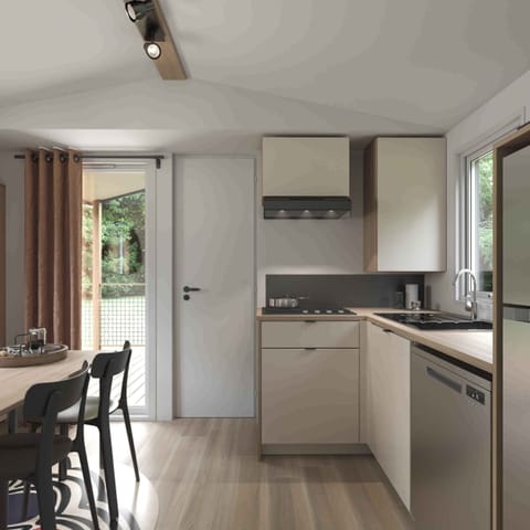 A modern kitchen equipped with sleek appliances and ample counter space flows seamlessly into the dining area, encouraging family meals and memories to be made together.