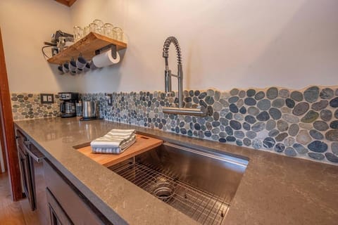 Fully stocked kitchen with high-end appliances and conveniences