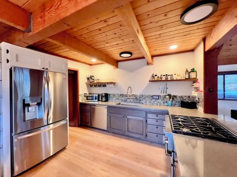 Fully stocked kitchen with high-end appliances and conveniences