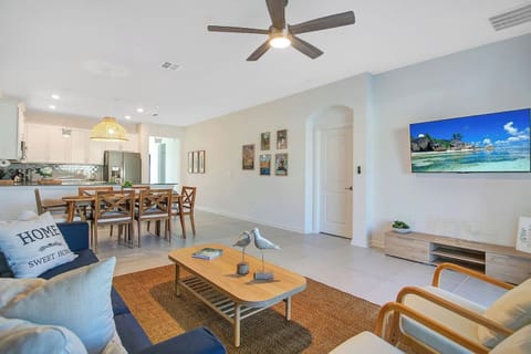 Living, dining, and kitchen space.