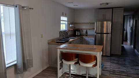 Breakfast Sitting for two people with Kitchen in the background.