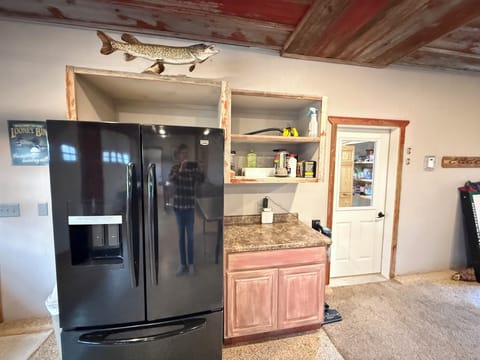 The rec room has a large refrigerator with easy access from outdoors