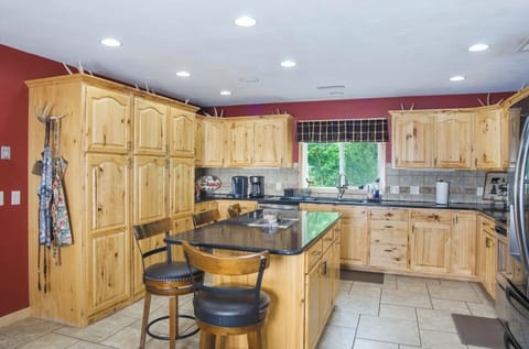 Comfortable center island for snack time and lots of cupboard space